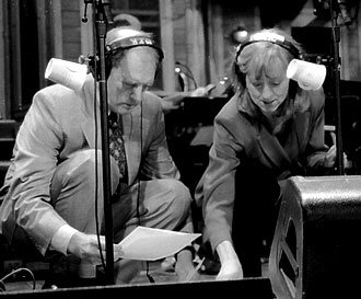 Tim Russell and Sue Scott shuffling through their scripts during a rehearsal for "A Prairie Home Companion" with Garrison Keillor.